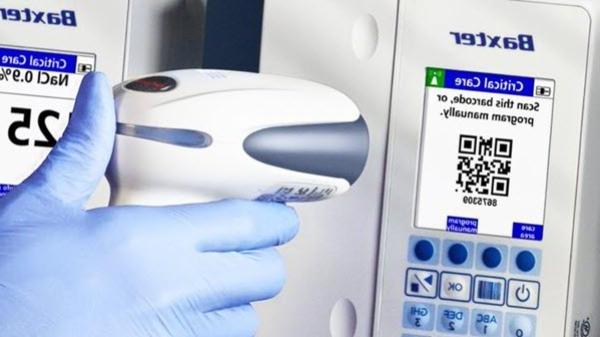 A healthcare provider scans a QR code on a medical device
